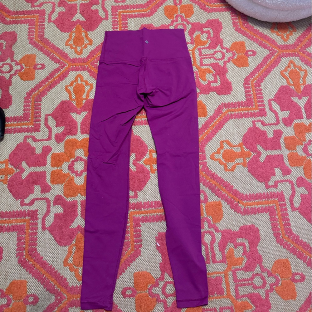 Lululemon Wunder Under leggings in a deep magenta/purple color